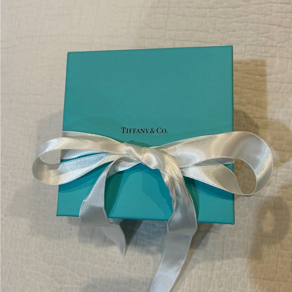 New Tiffany & Co.  box. Original white ribbon.